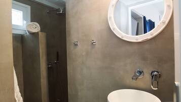 Shower, hair dryer, towels, toilet paper