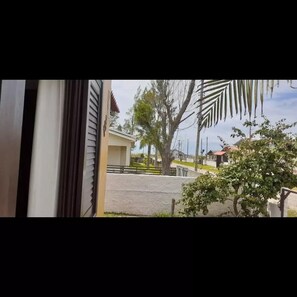 Guests can enjoy a serene view of the surrounding area from the comfort of their room.