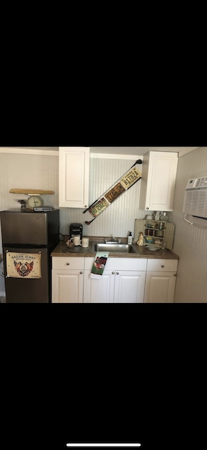 Fridge, microwave, coffee/tea maker, toaster