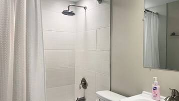 Combined shower/bathtub, hair dryer, towels, soap