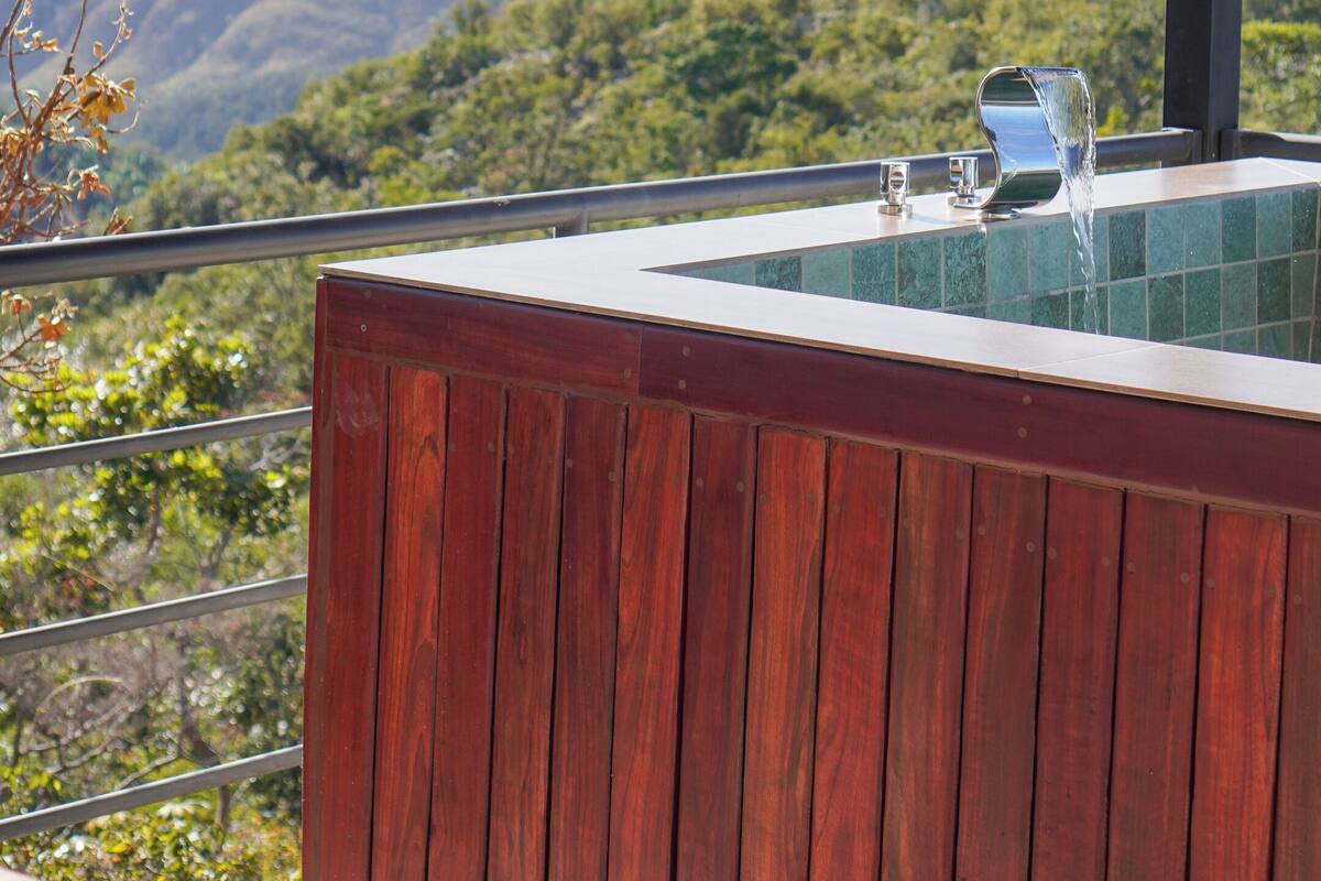 A wooden deck with a view of mountains.