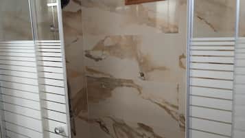 Combined shower/tub, hair dryer, towels, soap