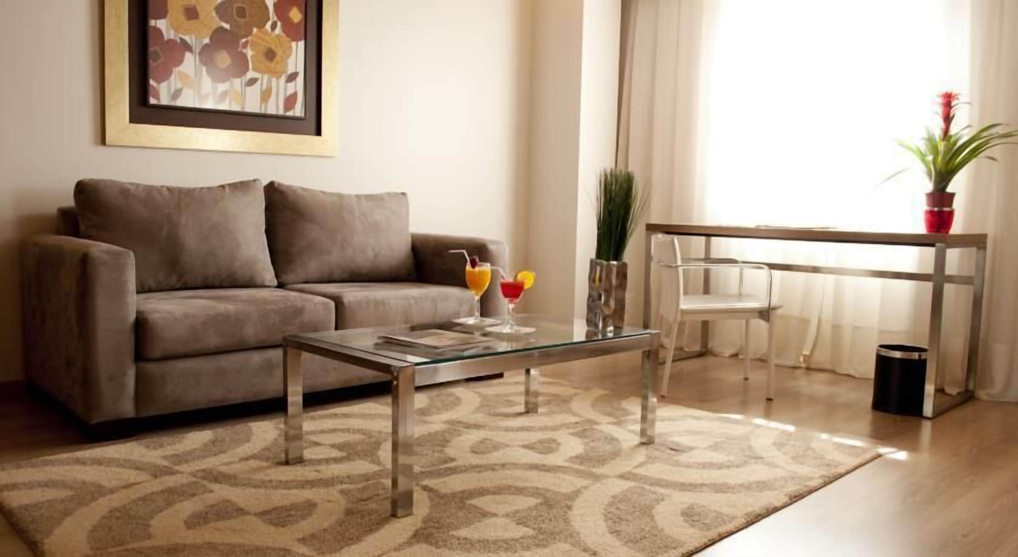 Premier Suite | Living area | 40-inch flat-screen TV with cable channels, TV