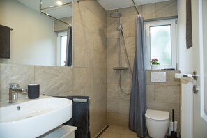 Shower, hair dryer, towels, soap