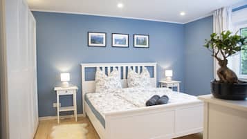 1 bedroom, desk, iron/ironing board, travel crib