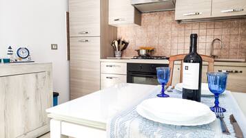 Fridge, oven, coffee/tea maker, cookware/dishes/utensils