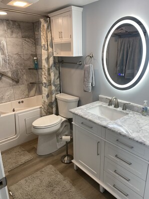 Combined shower/bathtub, jetted bath, hair dryer, towels - Oceanfront - Directly On the Ocean Luxury 3BR Condo Sleeps 6 to 8 - with a pool (Melbourne Beach)