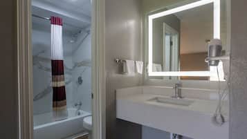 Standard Single Room | Bathroom | Bathtub, hair dryer, soap, shampoo