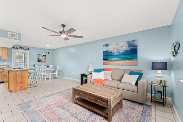 Bright and open living room/kitchen view. Queen sized sleeper sofa.
