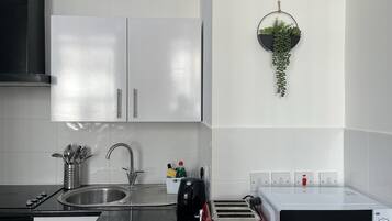 Microwave, coffee/tea maker, toaster, dining tables