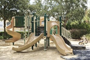 A playground with slides and climbing structures.