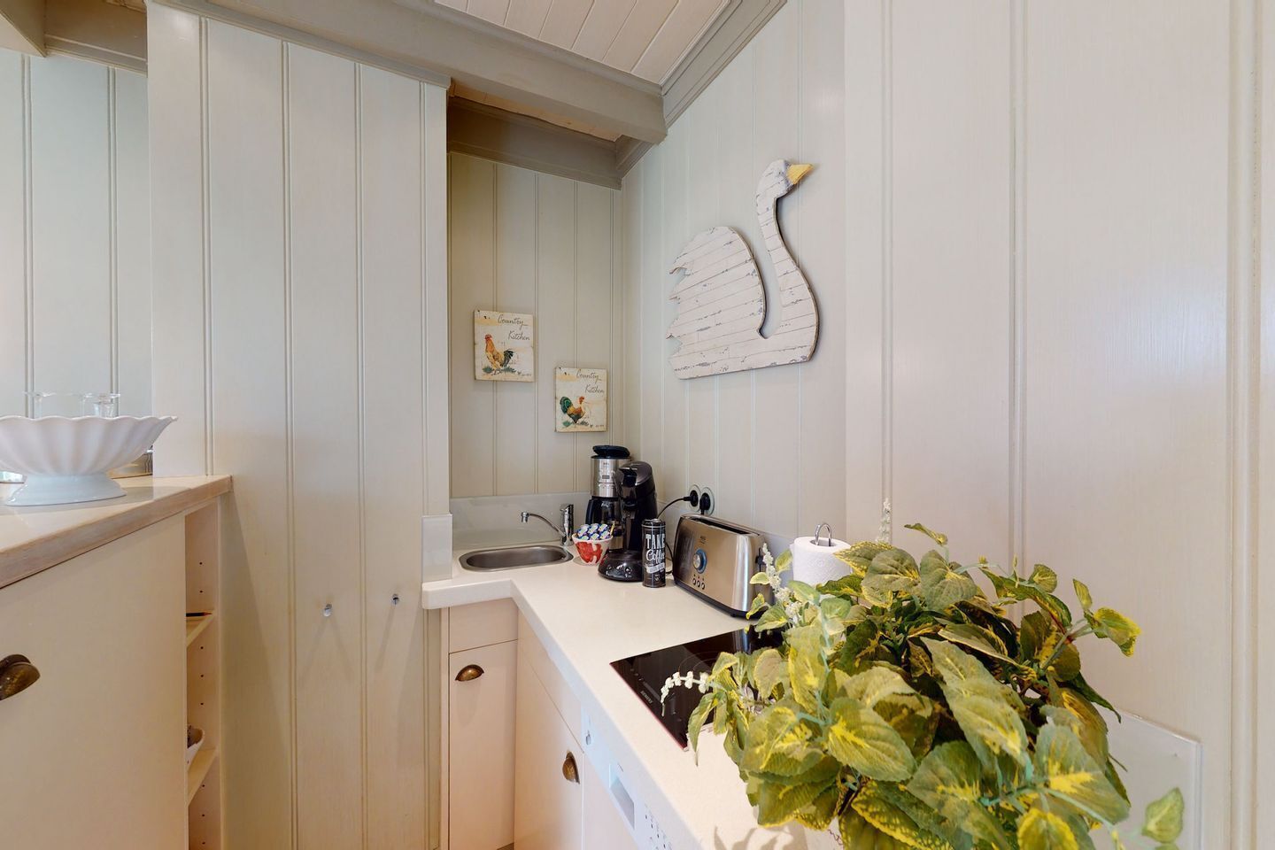 Coffee/tea maker, fridge, stovetop, dishwasher
