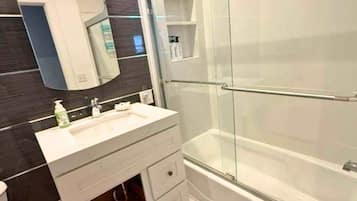 Combined shower/bathtub, hair dryer