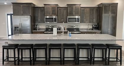 PRIVATE POOL AND HOT TUB! In Town spacious 8 Bedroom and 8.5 Bathroom home.