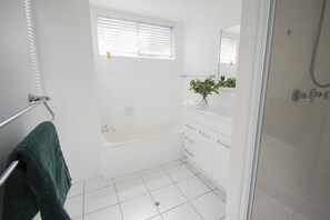 Bathtub, hair dryer, towels, soap