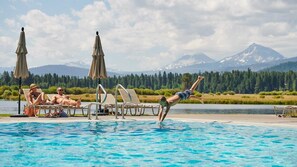 Relax by the pool with a breathtaking view of the surrounding mountains.