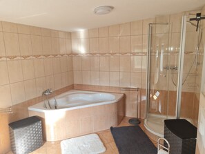 Bathtub, hair dryer, towels, soap