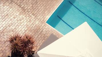 Outdoor pool, open 9:00 AM to 9:00 PM, pool umbrellas, sun loungers