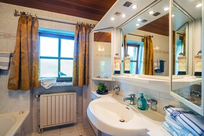 Bathtub, hair dryer, towels