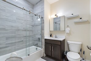 Combined shower/tub, hair dryer, towels, soap