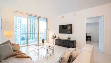 Basic Apartment | Living area | 32-inch flat-screen TV with cable channels, TV