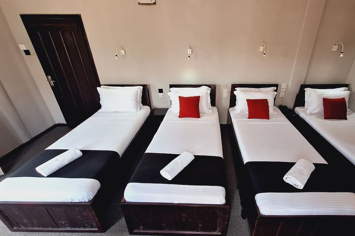 Family Room | Iron/ironing board, WiFi (free), bed sheets