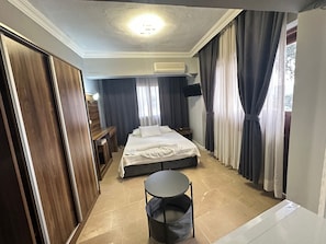 Economy Double or Twin Room | Bathroom | Shower, hydromassage showerhead, designer toiletries, hair dryer