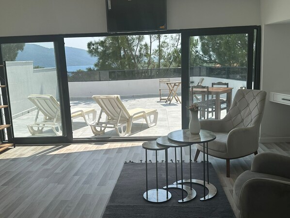 Elite Penthouse, 1 Bedroom, Sea View | Living area | 40-inch LCD TV with satellite channels, TV, toys