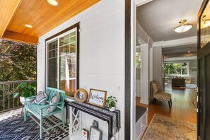 Enter a welcoming space with a bench near a large window offering a view of the outdoors.