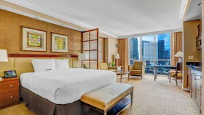 A hotel room with a large bed, a desk, a chair, a window with a city view, and a balcony. - Strip View MGM Signature  Studio ★ No resort fees (Las Vegas)