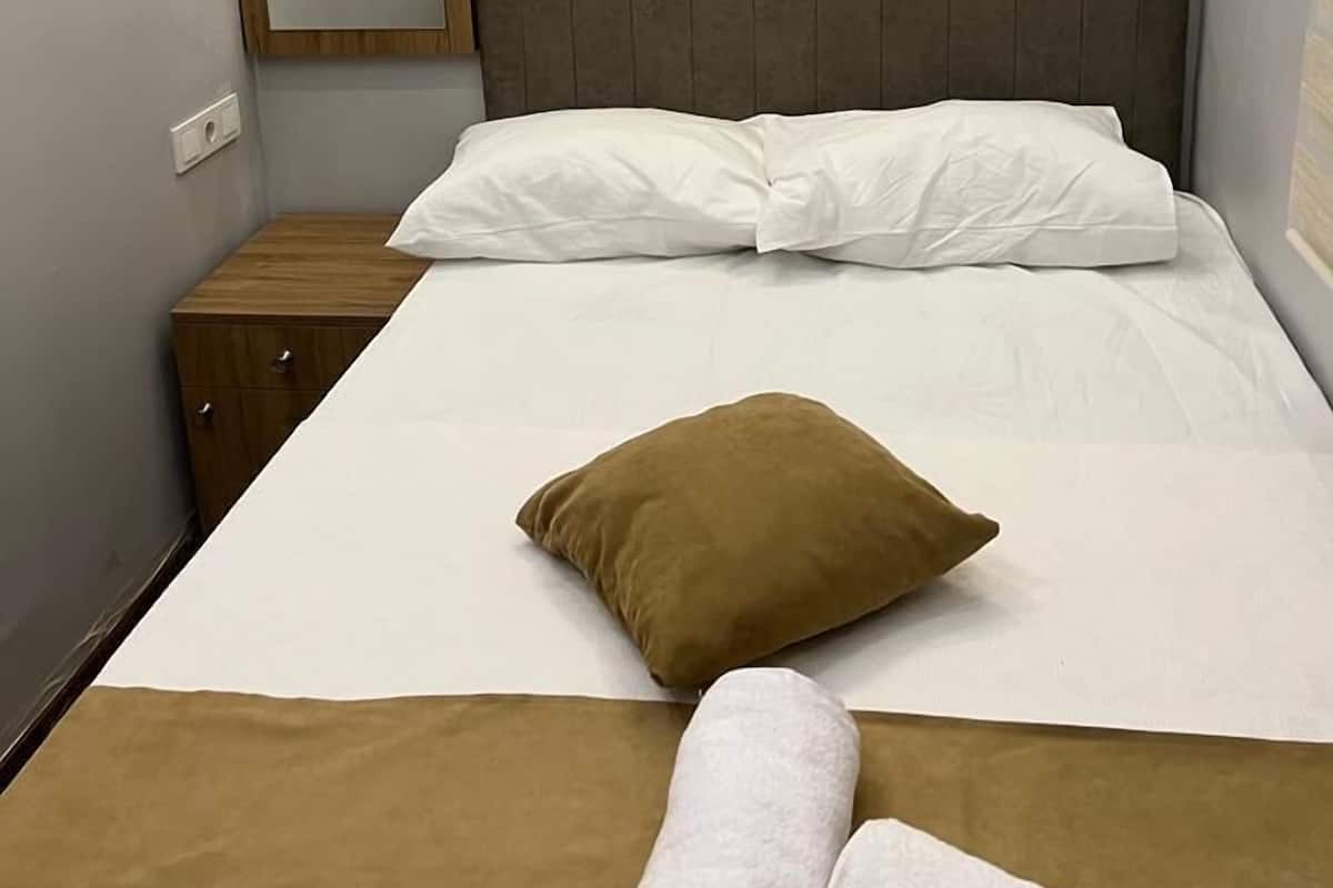 Desk, blackout drapes, soundproofing, iron/ironing board