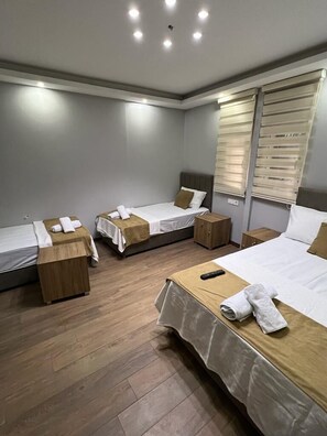 Business Quadruple Room, Multiple Beds | Desk, blackout curtains, soundproofing, iron/ironing board