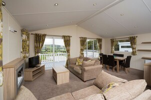 Indulgent Lakeside 8 Berth Lodge + Hot Tub + Private Peg | Living area