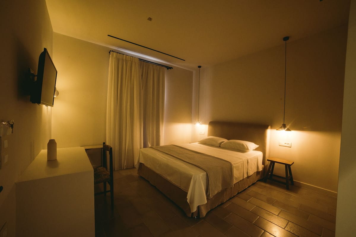 Habitación Deluxe | Ropa de cama de alta calidad, camas con efecto memoria y minibar 