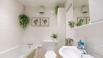 Shower, hair dryer, towels, shampoo