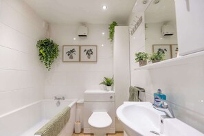 Shower, hair dryer, towels, shampoo