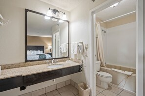 Combined shower/tub, designer toiletries, hair dryer, bathrobes