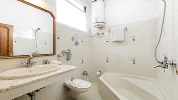 Separate bathtub and shower, free toiletries, towels, soap