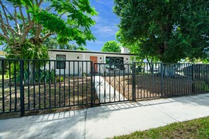 Stunning single-story home with a yard and a welcoming entrance.