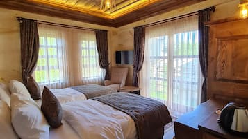 Quarto luxo, vista para o jardim | Vista do quarto