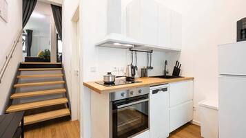 Fridge, stovetop, dishwasher, coffee/tea maker