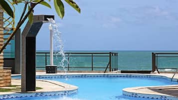 Outdoor pool, pool umbrellas, sun loungers