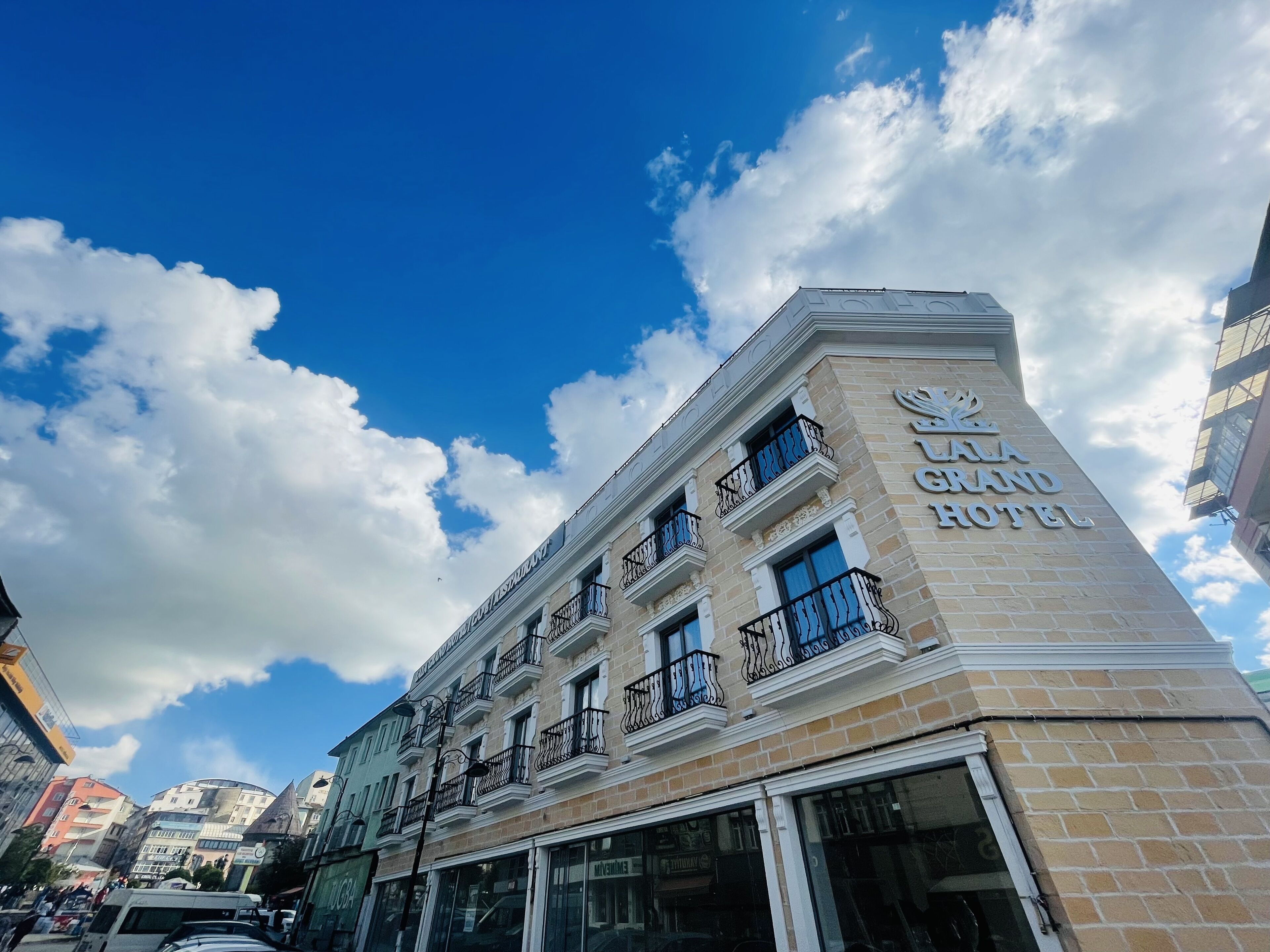 The exterior of the GALA GRAND HOTEL with a clear view of the building's facade, balconies, and the hotel's name.