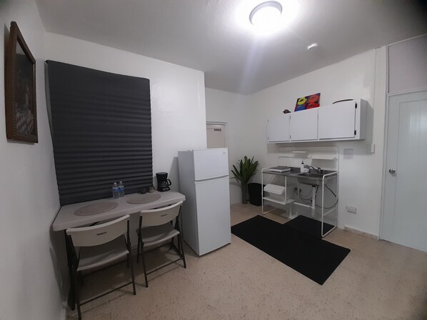 Fridge, microwave, stovetop, coffee/tea maker