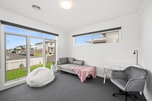Relax and work in style with a comfortable sofa, desk, and office chair.