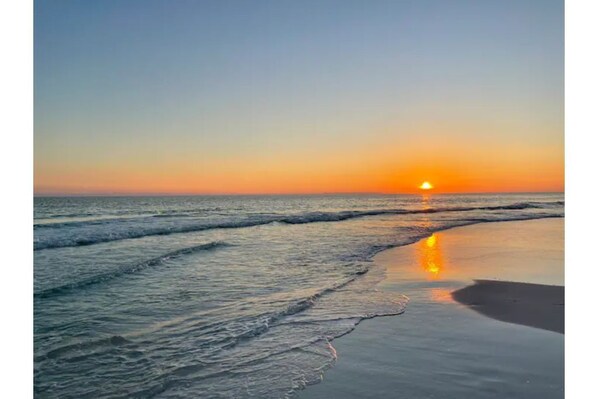 Experience the tranquility of the beach, where waves gently lap at the shore.