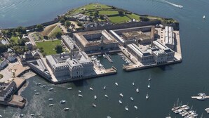 An aerial view of a fortified coastal area with a large building complex, a marina with numerous boats, and a small island with greenery and a clear sky. - 5 Brewhouse by Pureserviced (Plymouth)