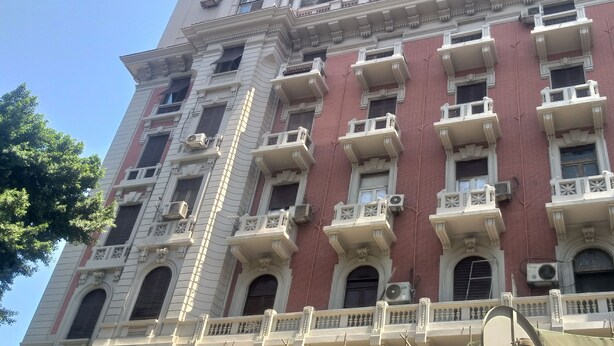 A multi-story building with a classical architectural style, featuring ornate balconies and large windows. - Gardenia Hotel (Cairo)