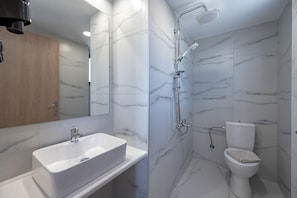 Shower, hair dryer, towels, shampoo