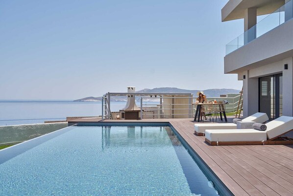 A heated pool, pool loungers